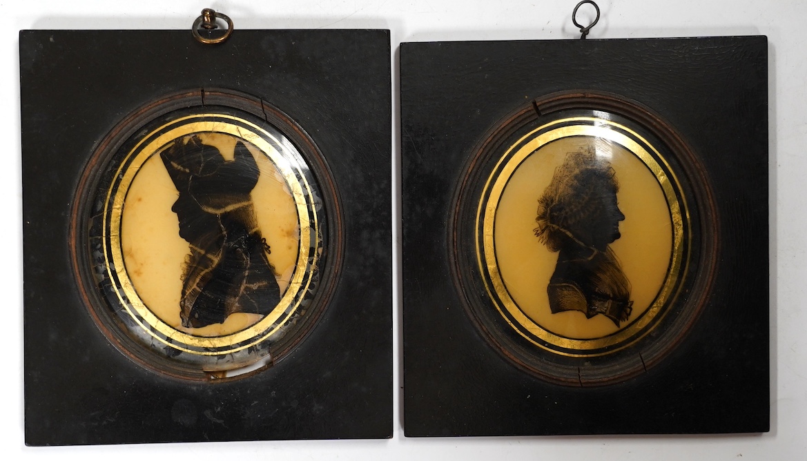 Attributed to Isabella Beetham (c.1753-1825), pair of reverse glass painted silhouettes portraits of Mr & Mrs Gostling, 9 x 8cm, housed in ebonised frames. Condition - poor